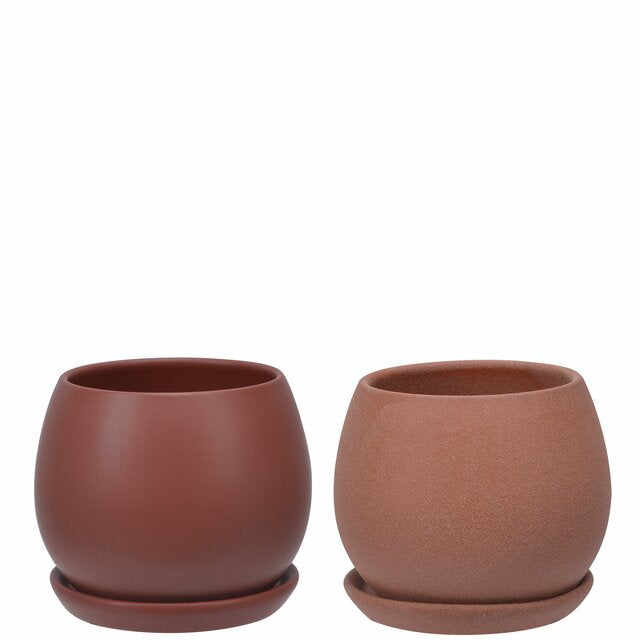 two clay pots on white background with different glaze finishes